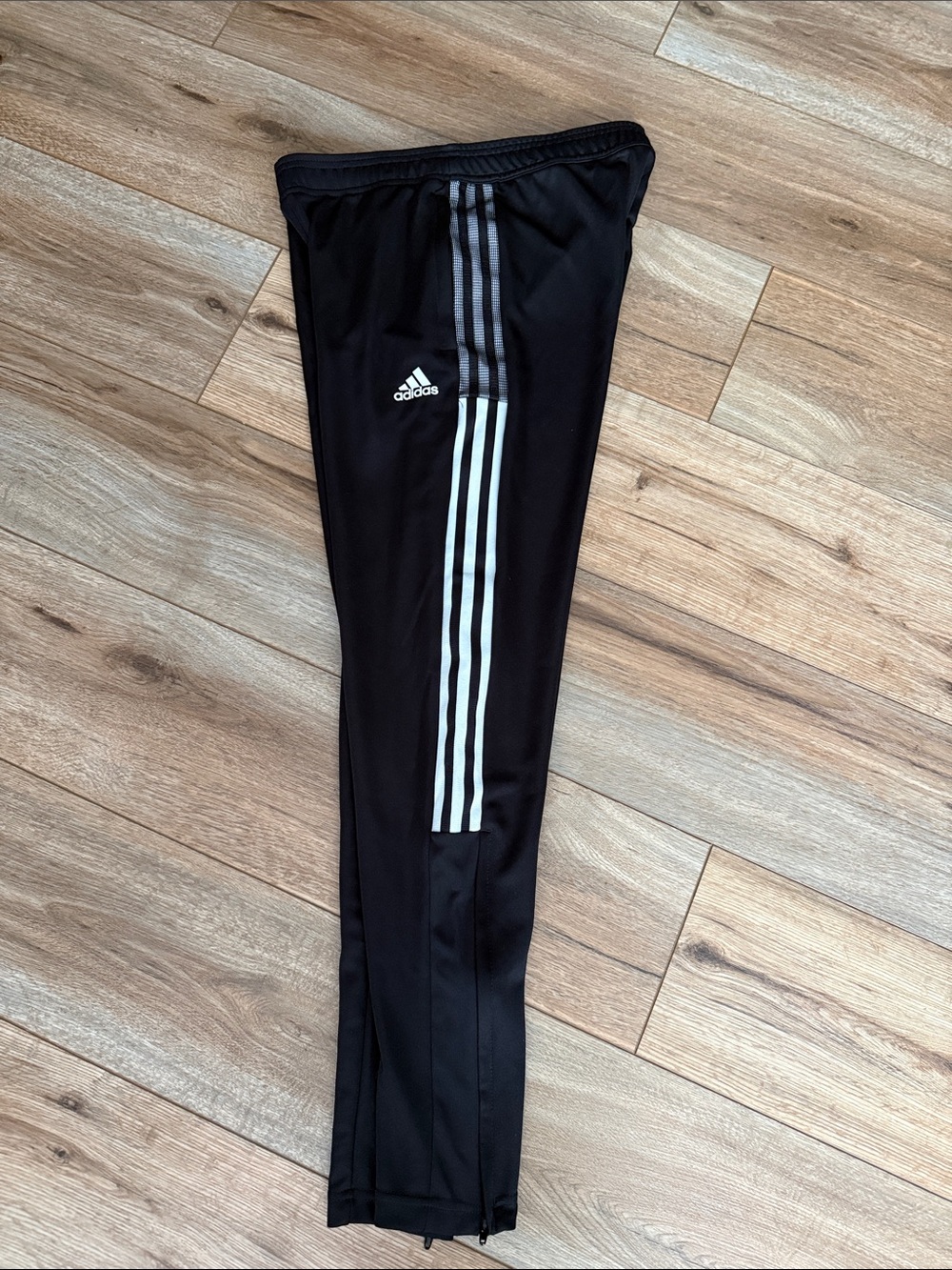 Women’s adidas Black Jogger Pants with White Three-Stripe, zip ankle Detail